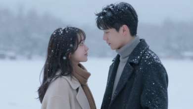 Couple sharing a moment in snowfall.